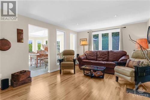 Huge Family room open to the Kitchen with gleaming foxwood birch, hardwood flooring installed in 2012. - 74 Trailway Circle, Ottawa, ON - Indoor Photo Showing Living Room