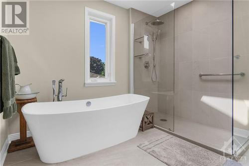 You'll love the on trend, luxury ensuite bathroom renovated in 2020. - 74 Trailway Circle, Ottawa, ON - Indoor Photo Showing Bathroom