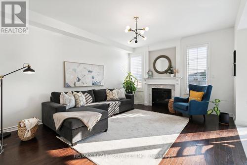 1308 Leger Way, Milton (Ford), ON - Indoor Photo Showing Living Room With Fireplace