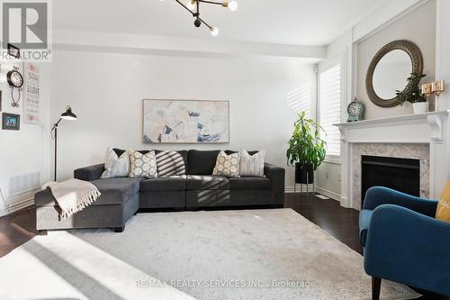 1308 Leger Way, Milton (Ford), ON - Indoor Photo Showing Living Room With Fireplace