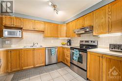 Seriously check out the size of this kitchen!! There’s so may cupboards and so much counter space. - 