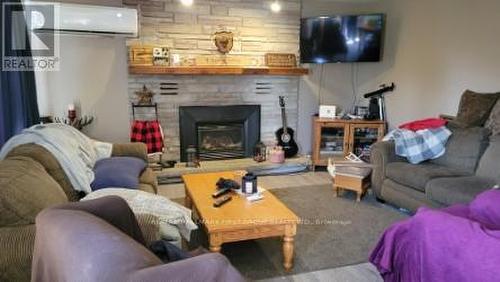 110227 Highway 7, Tweed, ON - Indoor Photo Showing Living Room With Fireplace