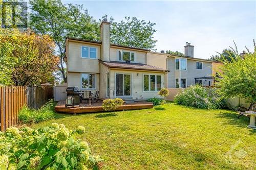 Private & fully-fenced yard w/ large deck, garden shed & mature perennials. - 1719 Des Broussailles Terrace, Ottawa, ON - Outdoor With Deck Patio Veranda