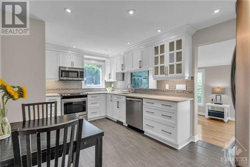 Updated kitchen with Cambrian quartz countertops, SS appliances & pot lights - 1719 Des Broussailles Terrace, Ottawa, ON - Indoor Photo Showing Kitchen With Upgraded Kitchen