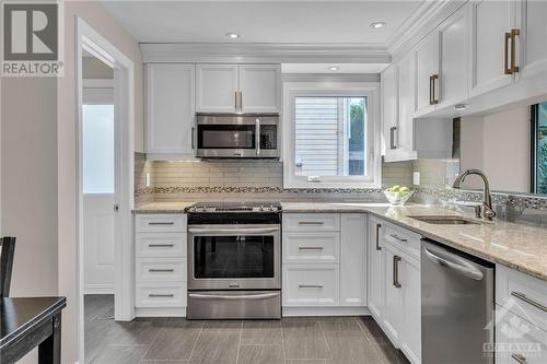 Updated kitchen with Cambrian quartz countertops, SS appliances & pot lights - 1719 Des Broussailles Terrace, Ottawa, ON - Indoor Photo Showing Kitchen With Upgraded Kitchen