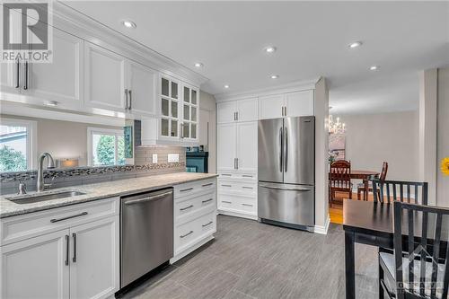 Updated kitchen with Cambrian quartz countertops, SS appliances & pot lights - 1719 Des Broussailles Terrace, Ottawa, ON - Indoor Photo Showing Kitchen With Upgraded Kitchen