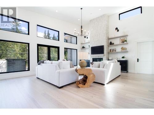 Living Room with 17' Ceilings - 2043 Airport Way, Revelstoke, BC - Indoor Photo Showing Living Room With Fireplace