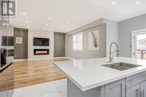 567 Sanderson Crescent, Milton, ON - Indoor Photo Showing Kitchen With Fireplace With Double Sink