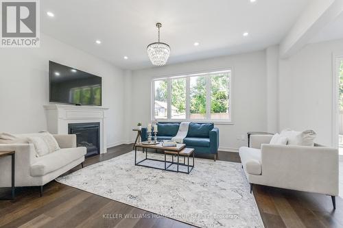 64 Harpin Way E, Centre Wellington (Fergus), ON - Indoor Photo Showing Living Room With Fireplace