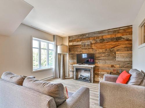 Living room - 301-50 Ch. Masson, Sainte-Marguerite-Du-Lac-Masson, QC - Indoor Photo Showing Living Room With Fireplace