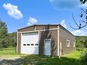 Garage - 255 Ch. Paquette, Mont-Tremblant, QC  - Outdoor With Exterior 