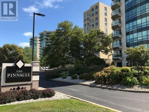 4789 Riverside Drive East Unit# 205, Windsor, ON - Outdoor With Balcony With Facade