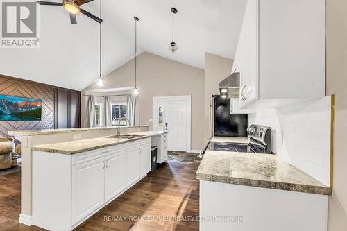 100 Queen Street, Kawartha Lakes (Fenelon Falls), ON - Indoor Photo Showing Kitchen With Fireplace