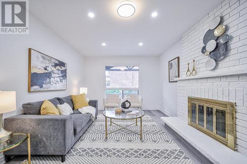 4 Waterwheel Street, Markham (Raymerville), ON - Indoor Photo Showing Living Room With Fireplace