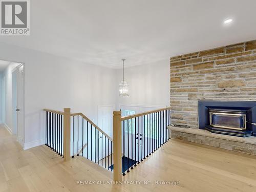 180 The Queensway Road N, Georgina (Historic Lakeshore Communities), ON - Indoor Photo Showing Other Room With Fireplace