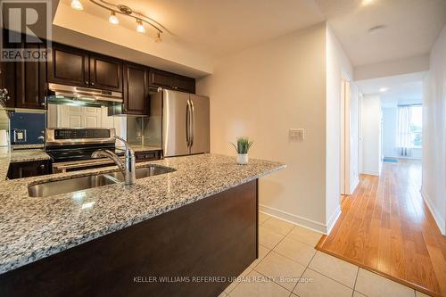 413 - 60 Fairfax Crescent, Toronto (Clairlea-Birchmount), ON - Indoor Photo Showing Kitchen With Stainless Steel Kitchen With Double Sink