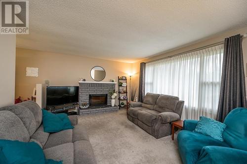 7668 Lemoyne Drive, Prince George, BC - Indoor Photo Showing Living Room With Fireplace