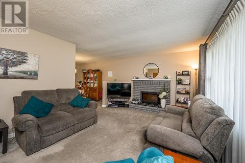 7668 Lemoyne Drive, Prince George, BC - Indoor Photo Showing Living Room With Fireplace