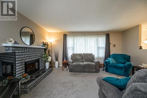 7668 Lemoyne Drive, Prince George, BC - Indoor Photo Showing Living Room With Fireplace