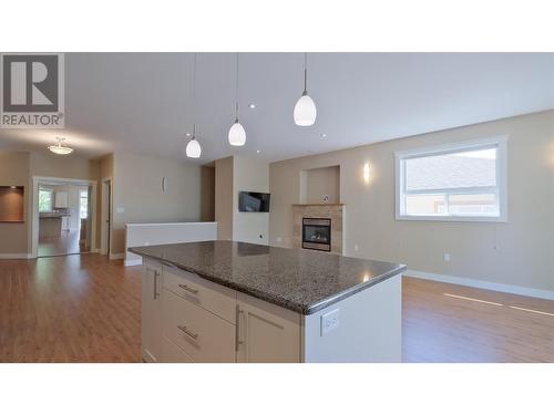 170 Stocks Crescent Unit# 114, Penticton, BC - Indoor Photo Showing Kitchen With Fireplace