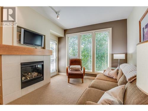 7343 Okanagan Landing Road Unit# 1211, Vernon, BC - Indoor Photo Showing Living Room With Fireplace