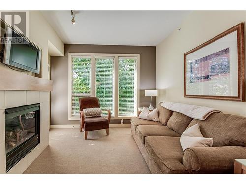 7343 Okanagan Landing Road Unit# 1211, Vernon, BC - Indoor Photo Showing Living Room With Fireplace