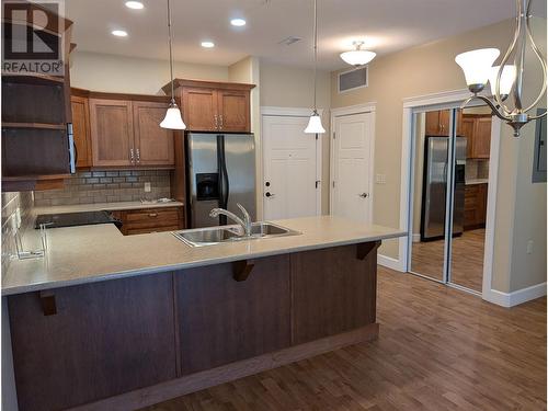 9100 Mackie Drive Unit# 104, Coldstream, BC - Indoor Photo Showing Kitchen With Double Sink