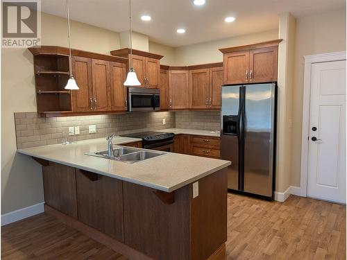 9100 Mackie Drive Unit# 104, Coldstream, BC - Indoor Photo Showing Kitchen With Double Sink