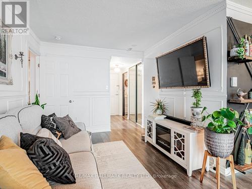 1115 - 20 Dean Park Road, Toronto (Rouge), ON - Indoor Photo Showing Living Room With Fireplace