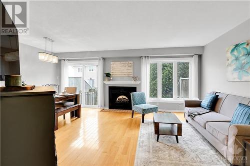 24 Meadowbreeze Drive, Ottawa, ON - Indoor Photo Showing Living Room With Fireplace