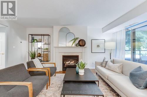 202 - 38 Avoca Avenue, Toronto (Rosedale-Moore Park), ON - Indoor Photo Showing Living Room With Fireplace