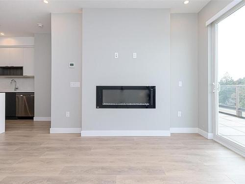 606-967 Whirlaway Cres, Langford, BC - Indoor Photo Showing Living Room With Fireplace