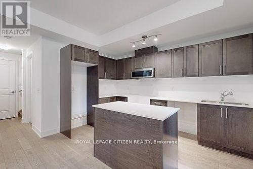 125 - 1062 Douglas Mccurdy Comn, Mississauga (Port Credit), ON - Indoor Photo Showing Kitchen With Double Sink