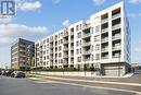 202 - 1440 Clarriage Court, Milton, ON  - Outdoor With Balcony With Facade 