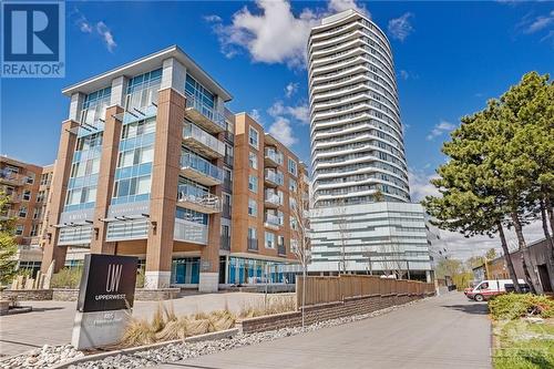 tall modern building - 485 Richmond Road Unit#502, Ottawa, ON - Outdoor With Facade