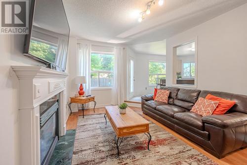 126 Madelaine Drive, Barrie, ON - Indoor Photo Showing Living Room With Fireplace