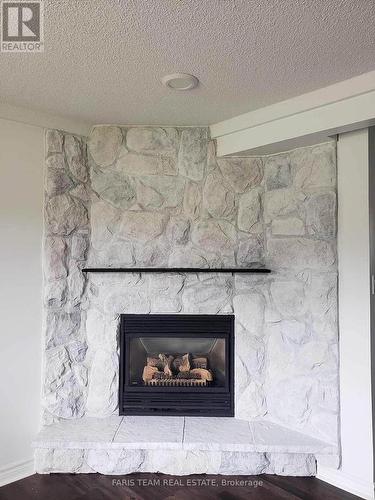 2387 Highway 11 North, Oro-Medonte, ON - Indoor Photo Showing Living Room With Fireplace