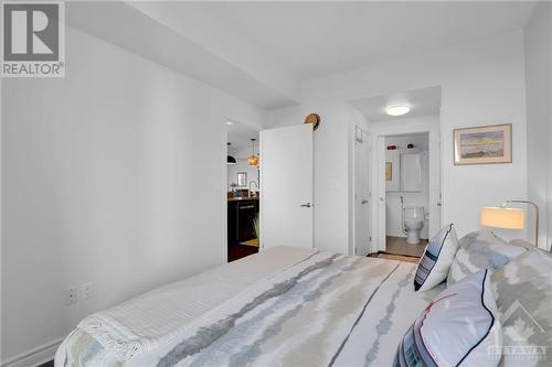 Walk through closets to ensuite for quiet privacy - 575 Byron Avenue Unit#413, Ottawa, ON - Indoor Photo Showing Bedroom