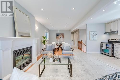 23 Hartley Avenue, Toronto (Briar Hill-Belgravia), ON - Indoor Photo Showing Living Room With Fireplace