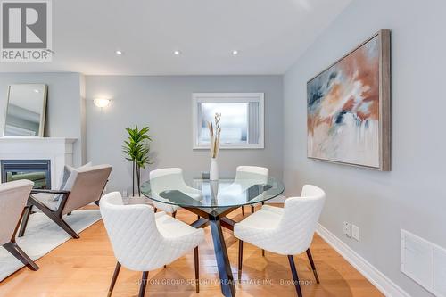 23 Hartley Avenue, Toronto (Briar Hill-Belgravia), ON - Indoor Photo Showing Dining Room With Fireplace