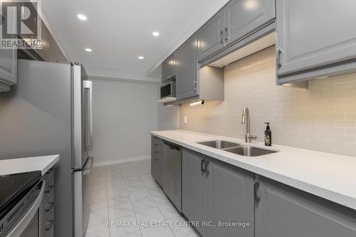 903 - 155 Marlee Avenue, Toronto (Briar Hill-Belgravia), ON - Indoor Photo Showing Kitchen With Double Sink With Upgraded Kitchen