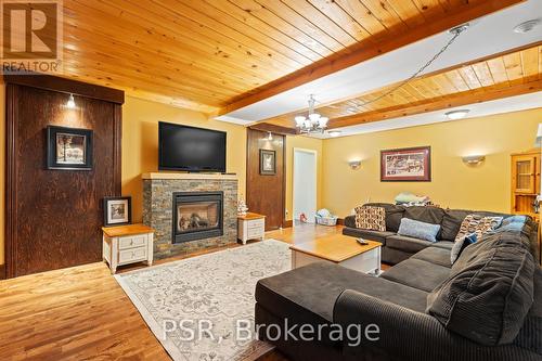 1037 Milford Bay Road, Muskoka Lakes, ON - Indoor Photo Showing Living Room With Fireplace