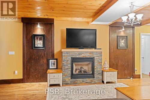 1037 Milford Bay Road, Muskoka Lakes, ON - Indoor Photo Showing Living Room With Fireplace