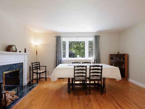 Dining room - 59 Rue Maryvale, Beaconsfield, QC - Indoor Photo Showing Dining Room With Fireplace