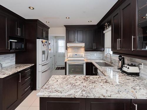 Kitchen - 4551  - 4555A Ch. Du Souvenir, Laval (Chomedey), QC - Indoor Photo Showing Kitchen With Upgraded Kitchen