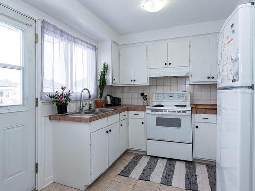 Kitchen - 4551  - 4555A Ch. Du Souvenir, Laval (Chomedey), QC - Indoor Photo Showing Kitchen With Double Sink