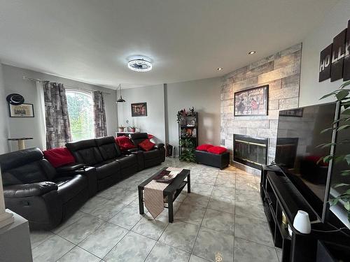 Salon - 120 Rue Béram, L'Épiphanie, QC - Indoor Photo Showing Living Room With Fireplace