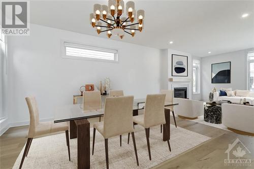 Virtually Staged - 525 Supernova Street, Ottawa, ON - Indoor Photo Showing Dining Room With Fireplace