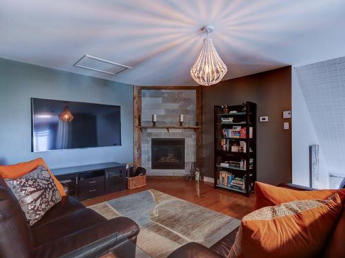 Salle familiale - 2-270 Rue Anne-Hébert, Saint-Basile-Le-Grand, QC - Indoor Photo Showing Living Room With Fireplace