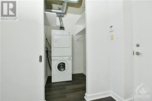 FRONT CLOSET | laundry, storage, space saving sliding door - 354 Gladstone Avenue Unit#502, Ottawa, ON - Indoor Photo Showing Laundry Room